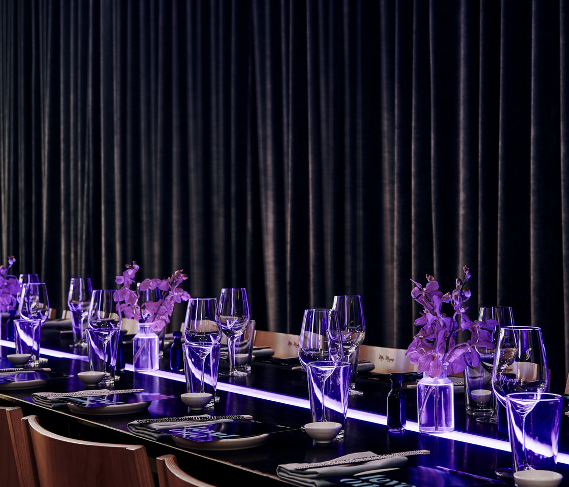 A long table set in the Level One event space
